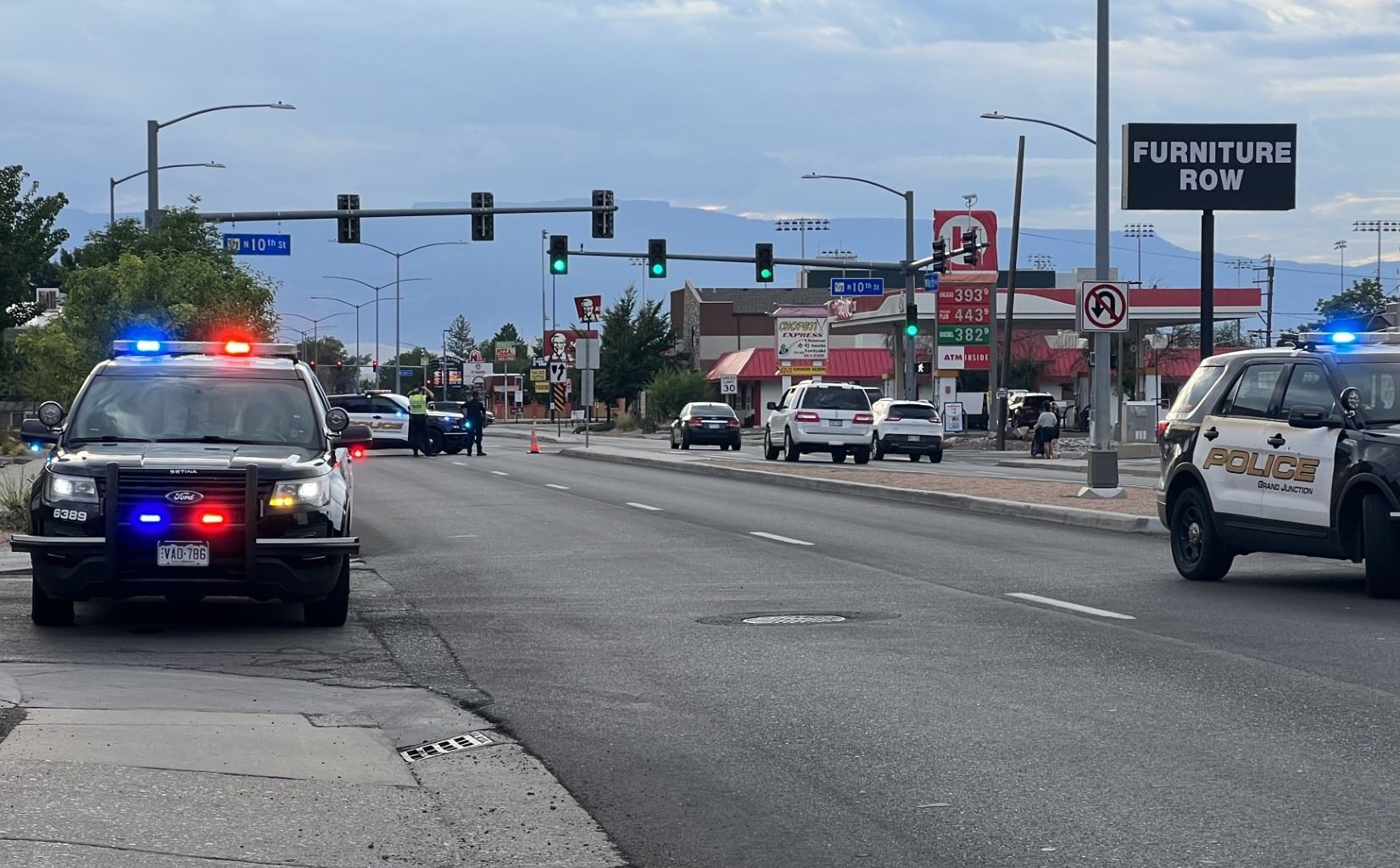 three Grand Junction Police patrol vehicles on North Avenue