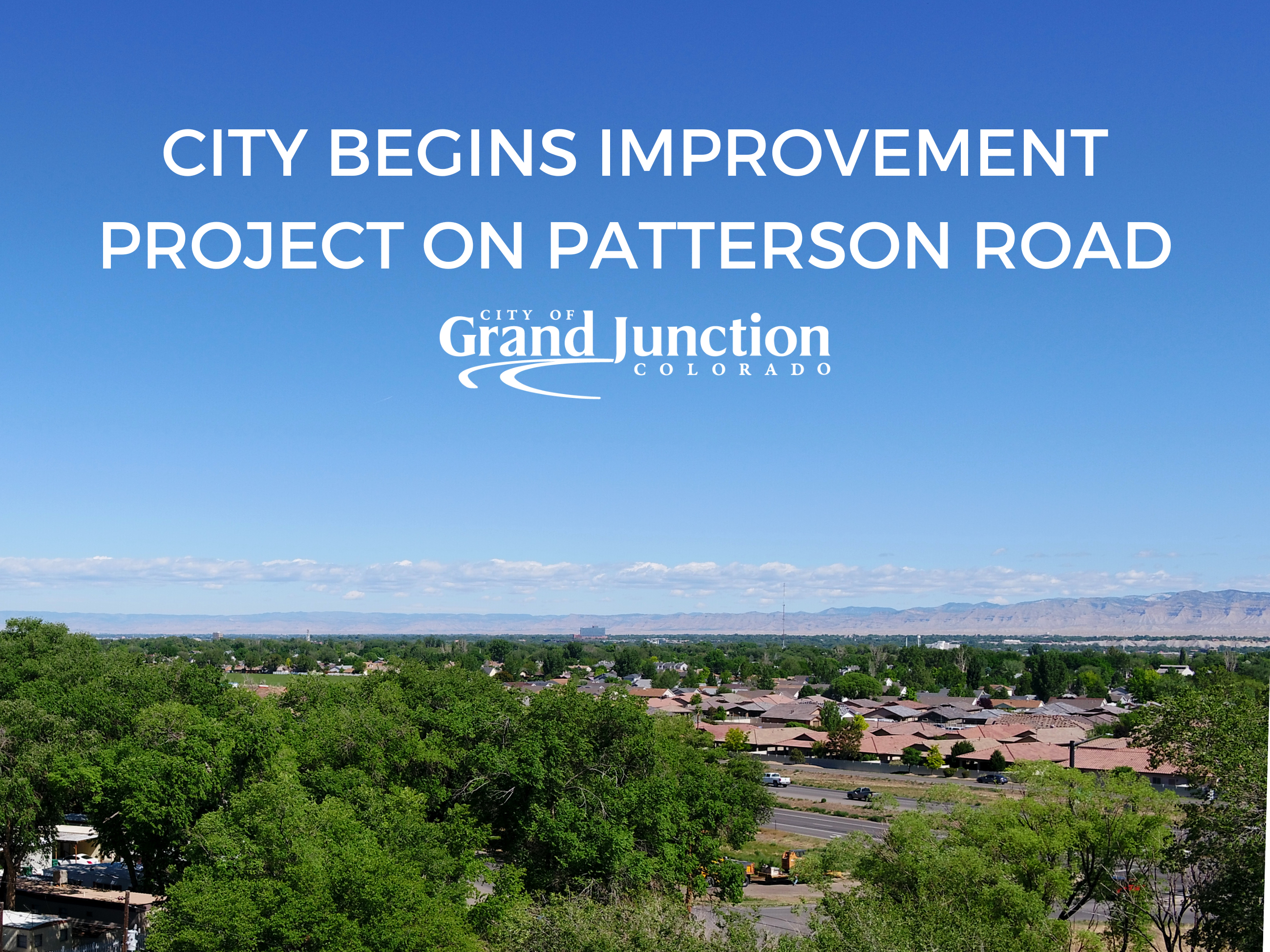 Ariel view of city with trees and houses. Text on graphic. 