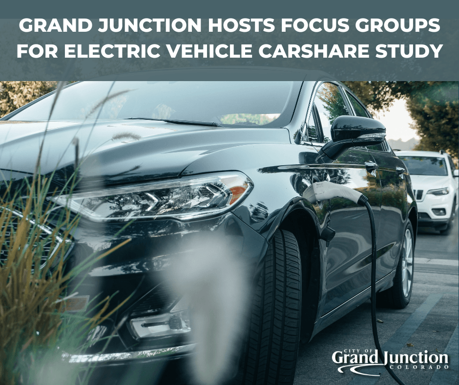 A parked black car charging. Text on graphic