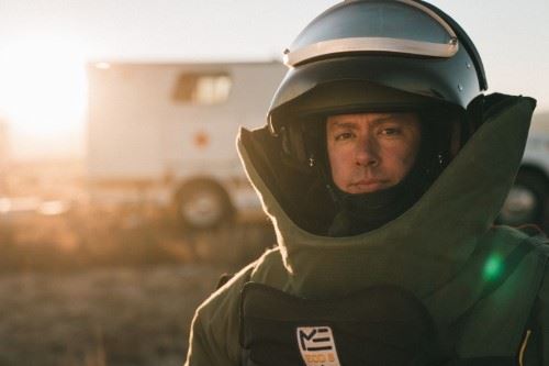 Man in a bomb force suit