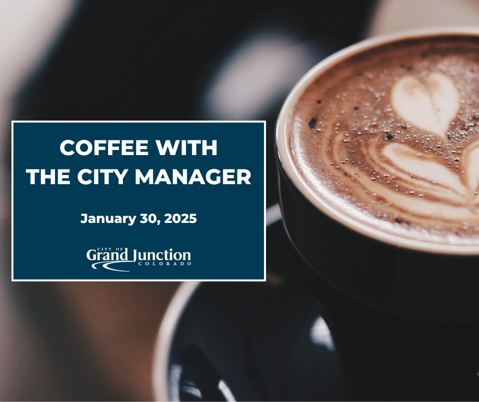 A cup with a latte design of a heart. 