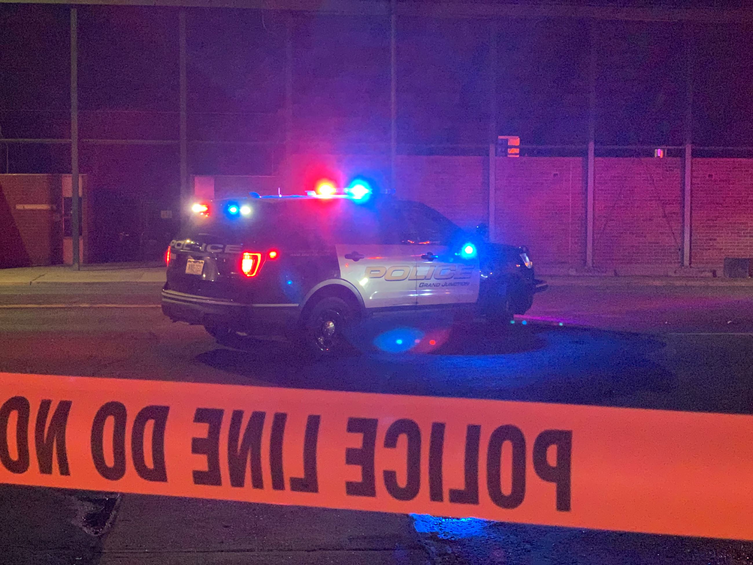 Patrol car at night with police tape