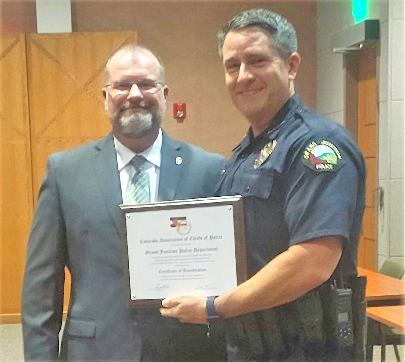 Chief Krouse presents Chief Shoemaker with CACP accreditation plaque