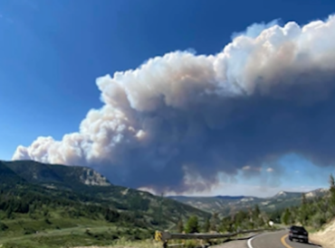 smoke over the mountains  in the distance