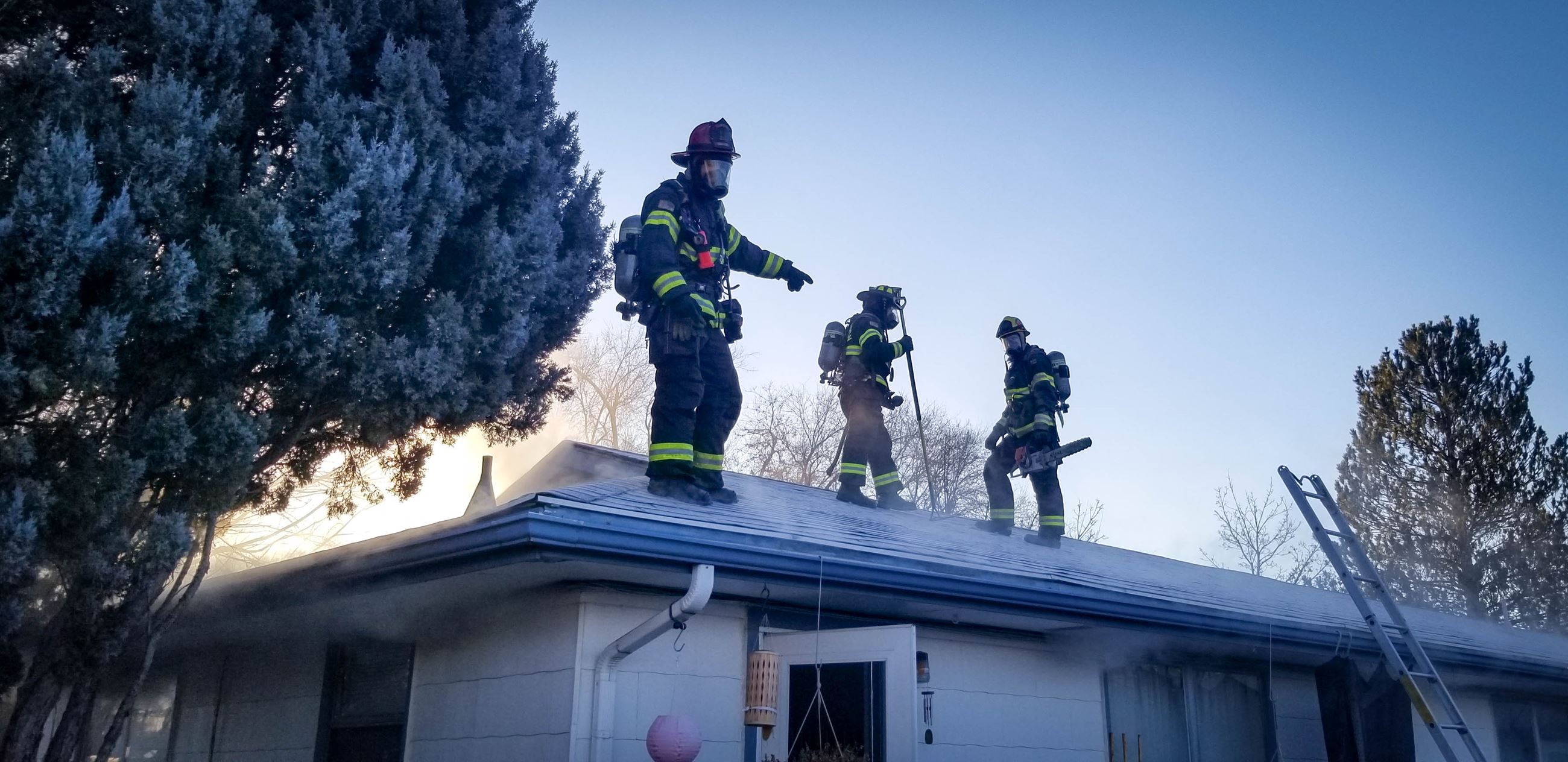 GJFD Firefighters on a roof