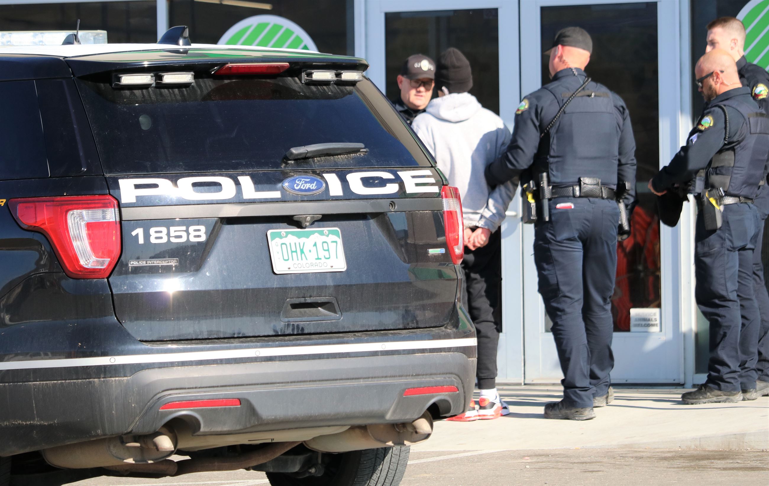 officers with suspect 