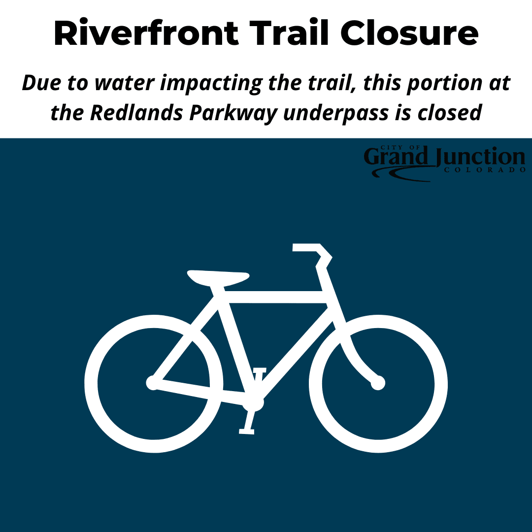 Bike with notice of trail closure at Redlands Parkway Underpass