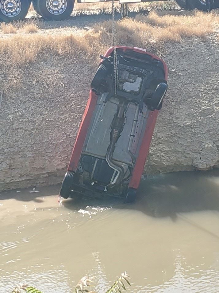 image of car being recovered from canal