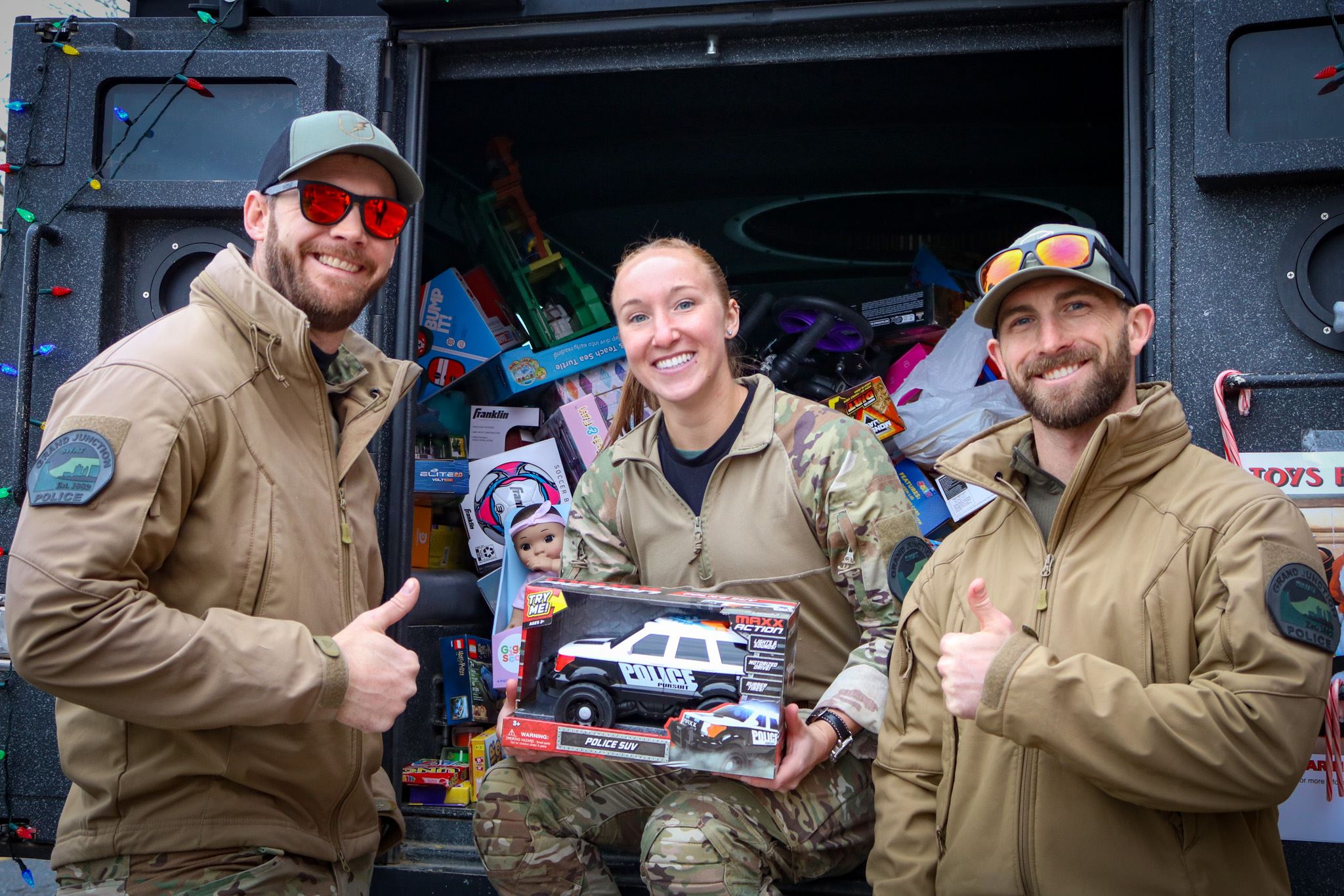 GJPD SWAT smiling with a toy
