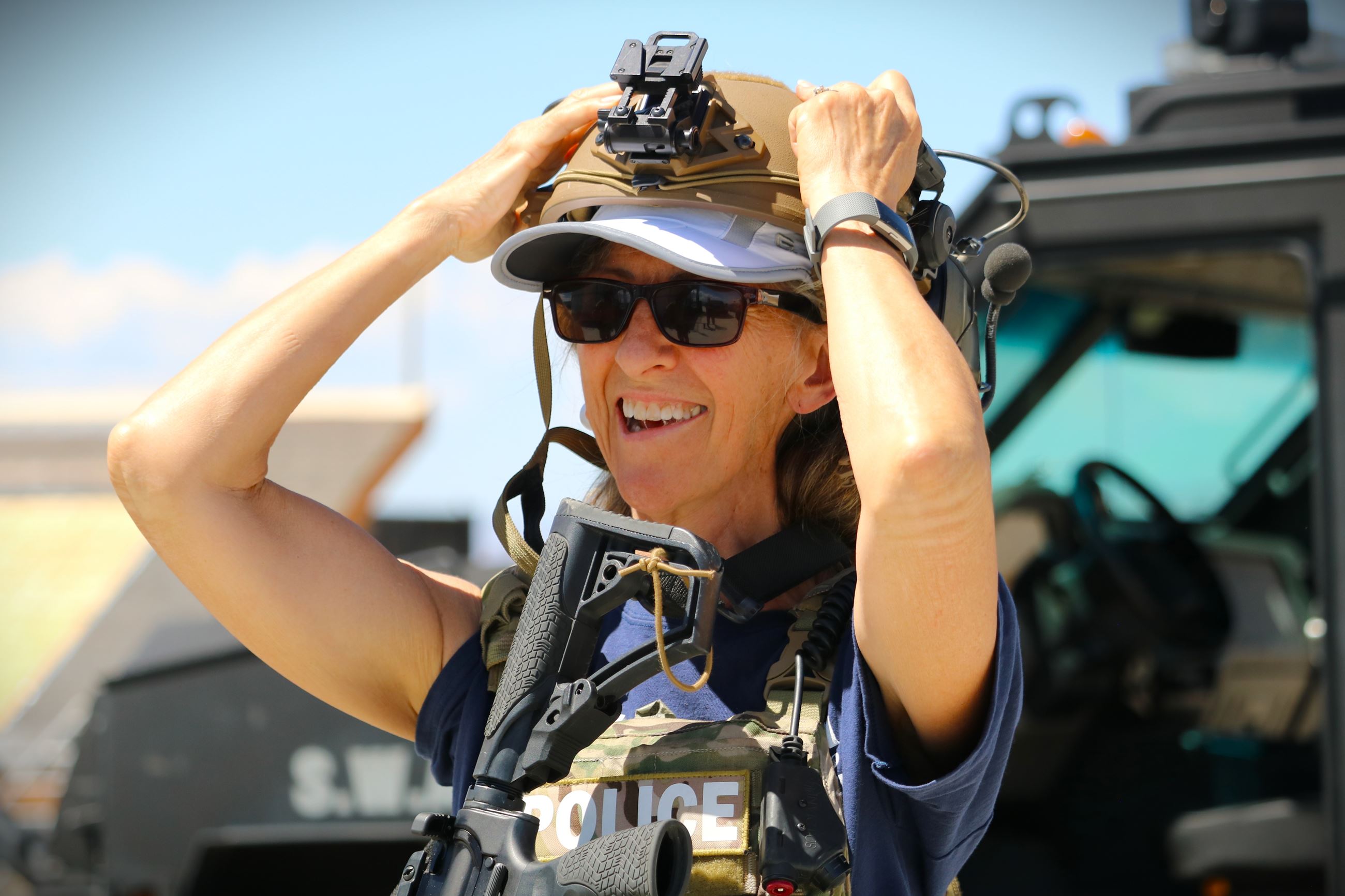Woman putting on SWAT gear